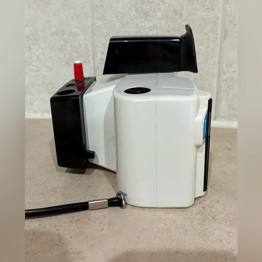 Vintage Polaroid Swinger camera and case